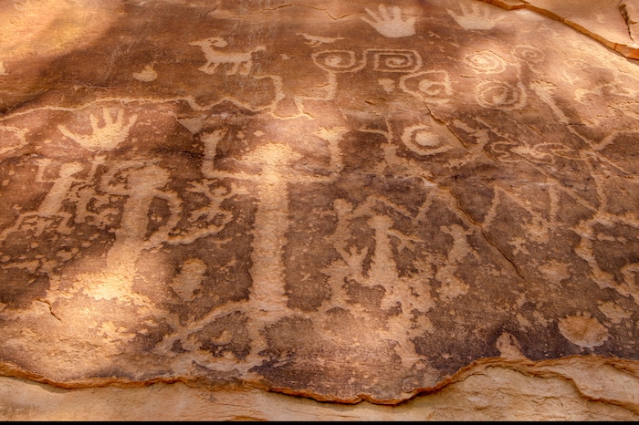 Petroglyphs at the end of the end of the Petroglyph Trail, in Chapin Mesa, Mesa Verde National Park in New Mexico on Aug. 20, 2019. In the red rock desert of the Southwest, an ancient culture was thought to have vanished but a new view connects it to pueblo dwellers of today. (John Burcham/The New York Times)