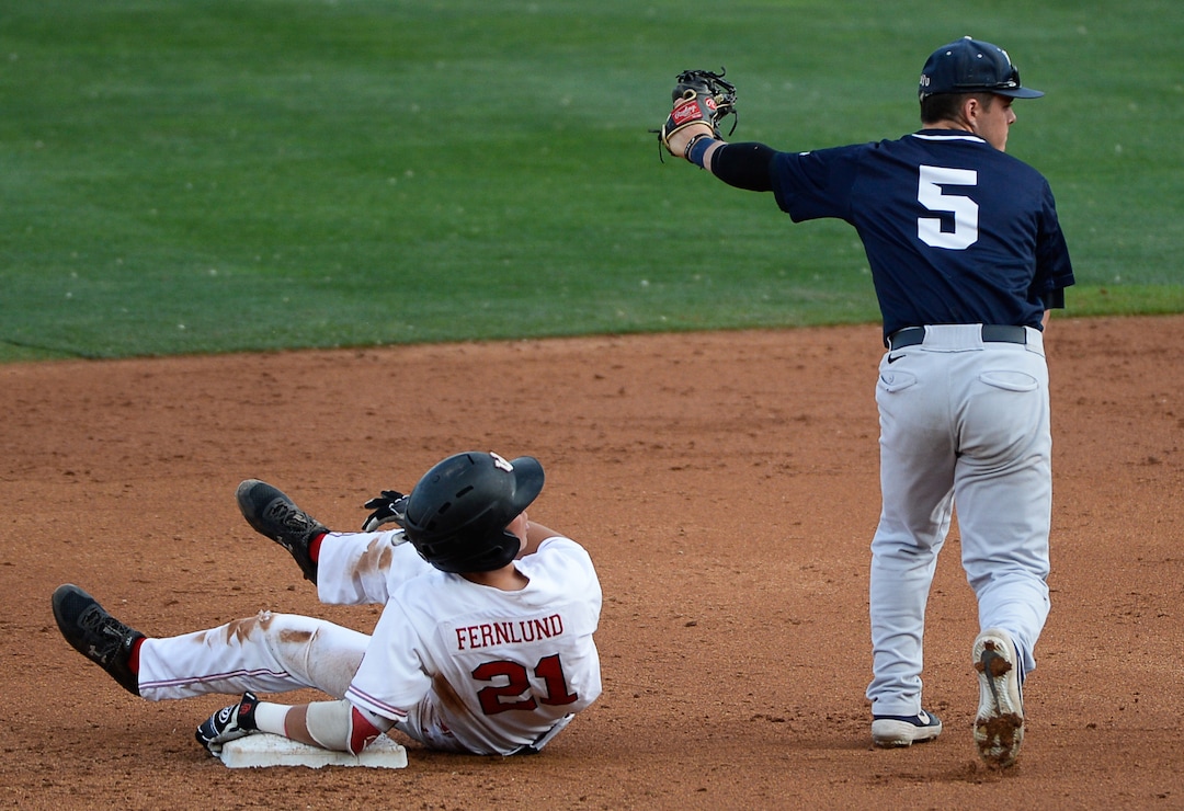 (Francisco Kjolseth  |  The Salt Lake Tribune)  Utah's Chase Fernlund looks up to see his out by Carson Matthews as Utah and BYU renew their rivalry on the baseball diamond as they battle it out at Smith's Ballpark in Salt Lake City on Tuesday, May 14, 2019.