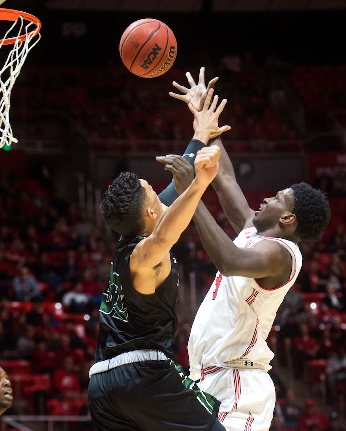 (Rick Egan  |  The Salt Lake Tribune) Utah Utes forward Donnie Tillman (3) takes a shot as Hawaii Warriors guard Samuta Avea (32) defends, in basketball action, Utah Utes vs Hawaii Warriors, at the Jon M. Huntsman Center, Saturday, December 2, 2017.