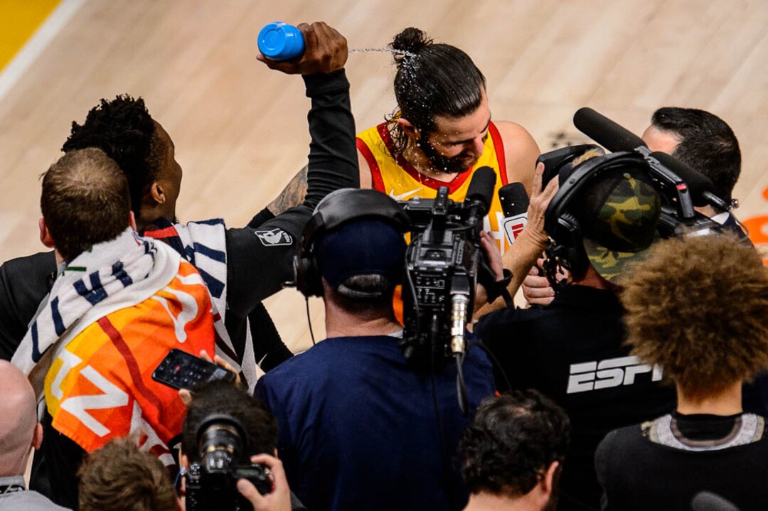 (Trent Nelson | The Salt Lake Tribune)  Utah Jazz host the Oklahoma City Thunder, Game 3, NBA playoff basketball in Salt Lake City, Saturday April 21, 2018. Utah Jazz guard Donovan Mitchell (45) sprays Utah Jazz guard Ricky Rubio (3) with water.