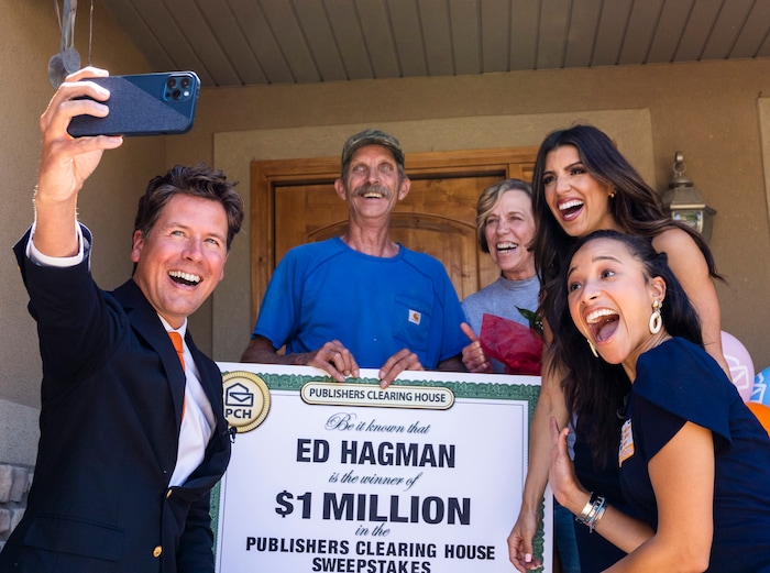(Rick Egan | The Salt Lake Tribune) Members of the Prize Patrol from Publishers Clearing House, from left,  Howie Guja, Danielle Lam and Bianca Quinnonez, take a selfie with Ed and Denise Hagman, after delivering the news that the Hagman's won $1,000,000, at their home in Herriman, on Friday, May 28th