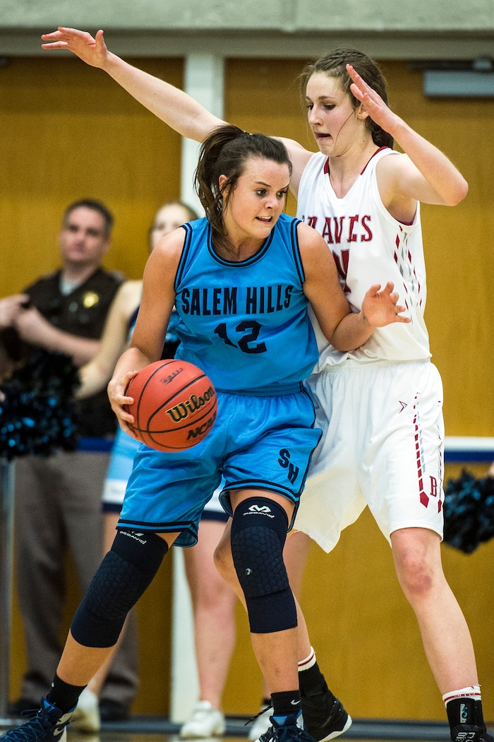 Chris Detrick  |  The Salt Lake TribuneBountiful's Kennedy Redding (24) guards Salem Hills's Lauren Gustin (12) during the 4A girls' basketball semifinals at Salt Lake Community College Friday February 26, 2016. Bountiful won the game 59-51.