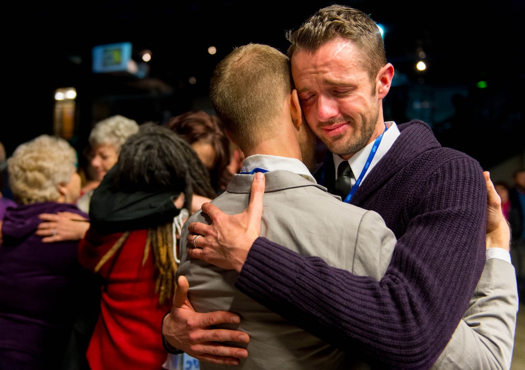 Trent Nelson  |  The Salt Lake TribuneTears run down Michael Ferguson's face as he and Seth Anderson take their first couple's dance at Love Elevated at the Rail Event Center Saturday January 11, 2014. Love Elevated, a celebration of same-sex marriages that occurred during the 17 days between U.S. District Judge Robert Shelby’s ruling striking down Utah's ban on gay marriages and the Supreme Court's stay on further marriages pending an appeal by the state, took place in Salt Lake City.