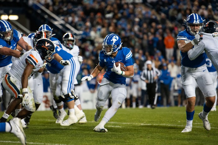 (Trevor Christensen | Special to The Tribune) Brigham Young University's Lopini Katoa runs the ball against Virginia during the second half at LaVell Edwards Stadium on Saturday, Oct. 30, 2021, in Provo.