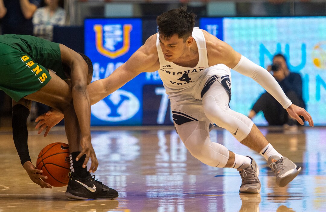 (Rick Egan  |  The Salt Lake Tribune)    Brigham Young Cougars guard Alex Barcello (4) goes for a loose ball along with San Francisco Dons guard Jamaree Bouyea (1), in WCC basketball acton between the Brigham Young Cougars and the San Francisco Dons, at the Marriott Center, Saturday, Feb. 8, 2020.