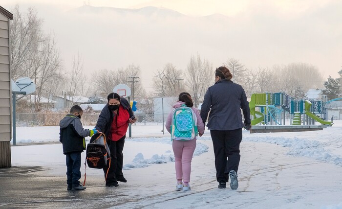 (Leah Hogsten | The Salt Lake Tribune) Parents walk their Escalante Elementary students back to class in Salt Lake City head back to class, January, 25, 2021. Salt Lake City School District reopened all of the district's elementary schools to in-person learning on Monday. It is the first time students in kindergarten through sixth grade are back in the classroom for a full day of school since they first closed for the pandemic in March 2020.