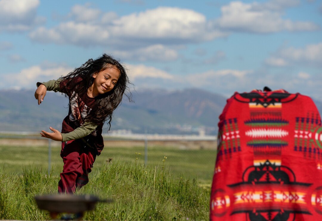 Leah Hogsten  |  The Salt Lake Tribune  Tangata 'Olakepa Tavi plays in the field near the ceremony. The "Stop the Polluting Port" community coalition staged a May Day celebration, calling for respect and awareness of the water, earth and air regarding the 20,000 acres west of Salt Lake City where the inland port industrial site has been proposed.