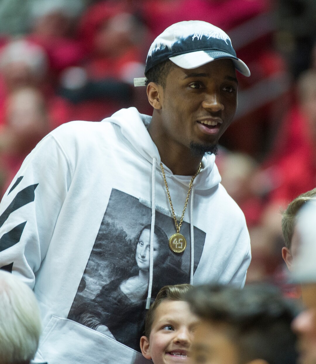 (Rick Egan  |  The Salt Lake Tribune)  Utah Jazz star Donovan Mitchell poses with fans , in NIT playoff action between Utah Utes and LSU Tigers at the Jon M. Huntsman Center, Monday, March 19, 2018.