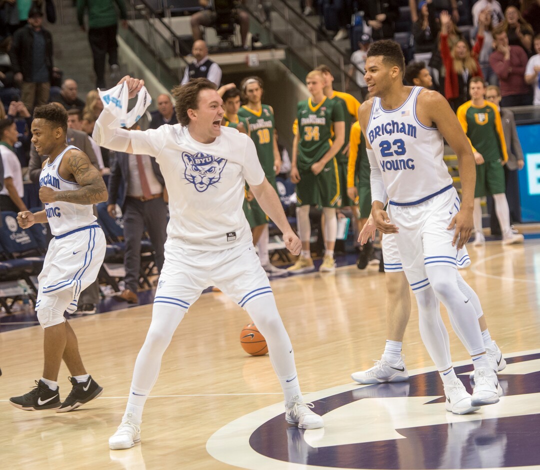 (Rick Egan  |  The Salt Lake Tribune)  Brigham Young Cougars  celebrate their win over the San Francisco Dons in overtime, in basketball action at the Marriott Center, Saturday, February 10, 2018.