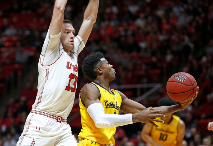 California guard Darius McNeill (1) lays the ball up as Utah forward David Collette (13) defends during the first half during an NCAA college basketball game Saturday, Feb. 10, 2018, in Salt Lake City. (AP Photo/Rick Bowmer)