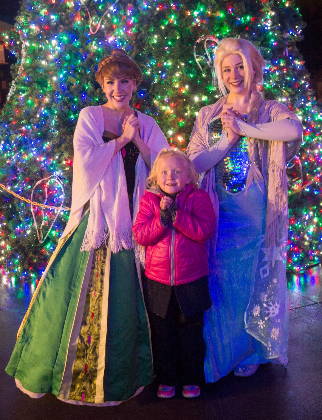 (Rick Egan  |  The Salt Lake Tribune)   The Ellie Taylor, 5, poses for a photo with Anna and Elsa, as the ZooLights at Hogle Zoo are turned on, Friday, Nov. 30, 2018. The lights continue  through December 31st, 