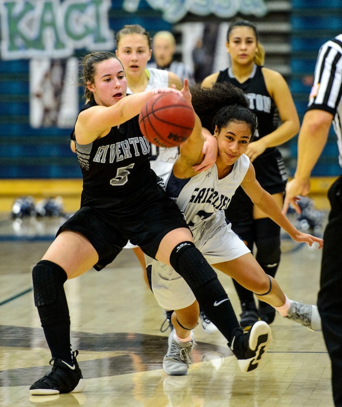 (Steve Griffin  |  The Salt Lake Tribune)  Riverton's Matty McDonald, left, and Copper Hill's guard Eleyana Tafisi battle for the ball during the Riverton versus Copper Hills girl's basketball game at Cooper Hill s High School in West Jordan Thursday February 1, 2018.