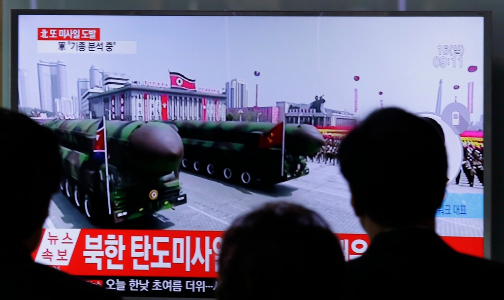 People watch a TV showing North Korea's missiles during Saturday's military parade in Pyongyang in North Korea, at Seoul Railway Station in Seoul, South Korea, Sunday, April 16, 2017. (AP Photo/Ahn Young-joon)