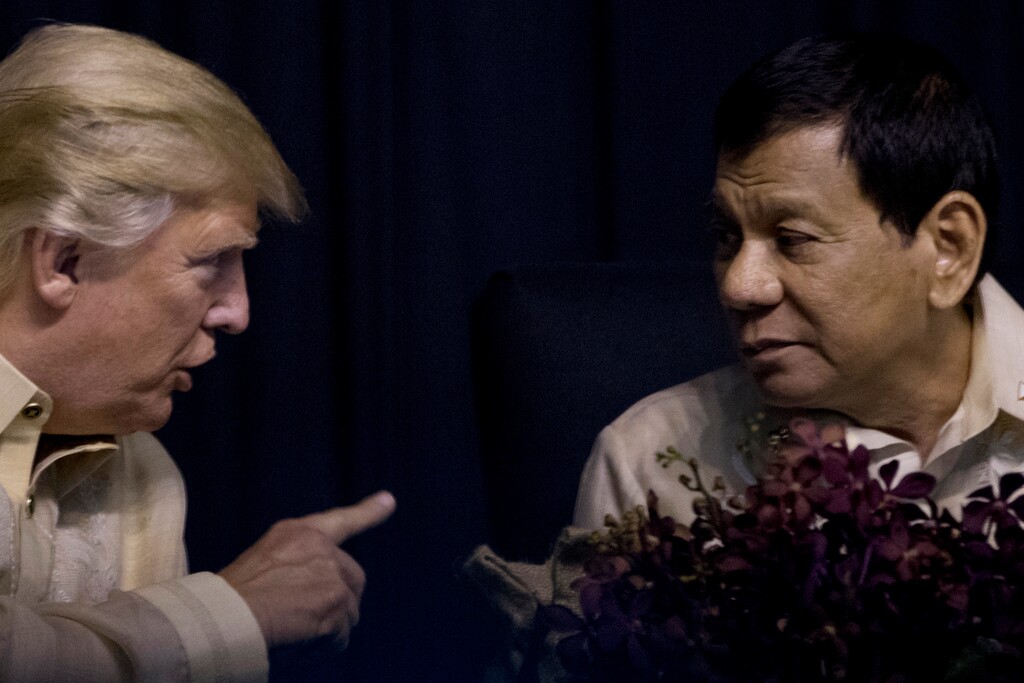 President Donald Trump speaks with Philippines President Rodrigo Duterte at an ASEAN Summit dinner at the SMX Convention Center, Sunday, Nov. 12, 2017, in Manila, Philippines. (AP Photo/Andrew Harnik)