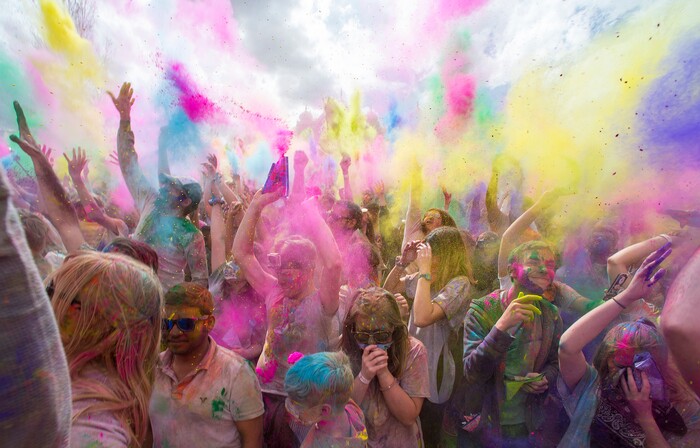 (Rick Egan  |  The Salt Lake Tribune)     Revelers celebrate spring as they toss colored powder into the air, during the 22nd annual Holi Festival of Colors at the Sri Sri Radha Krishna Temple in Spanish Fork, Saturday, March 24, 2018. The festival which celebrates the beginning or spring is also known as at the Festival of Love.