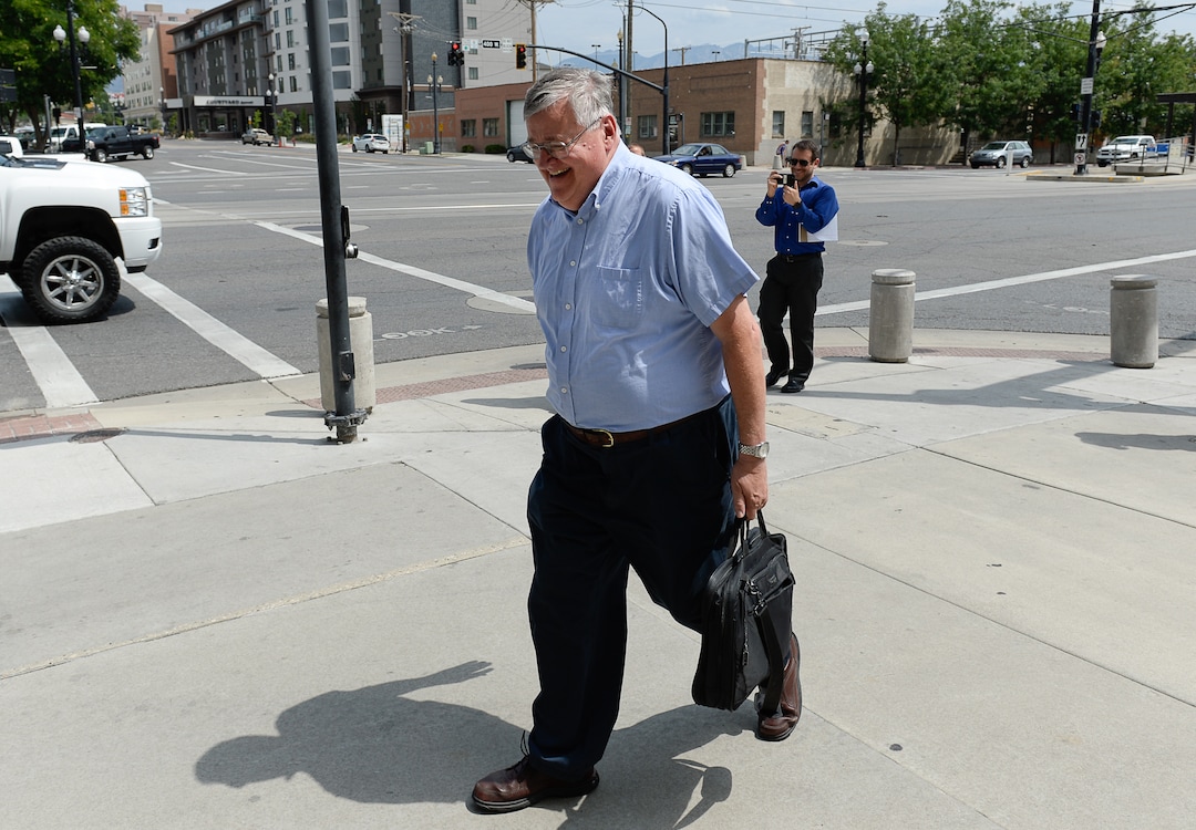 (Francisco Kjolseth  |  The Salt Lake Tribune)  Salt Lake Tribune writer Lee Davidson finishes his race against colleagues after using TRAX in a transportation race from Library Square to the Tribune building at the Gateway on Thursday, Aug. 2, 2018. Modes of transportation included, rentable electric scooters, Green Bike, TRAX, Lyft, and walking.