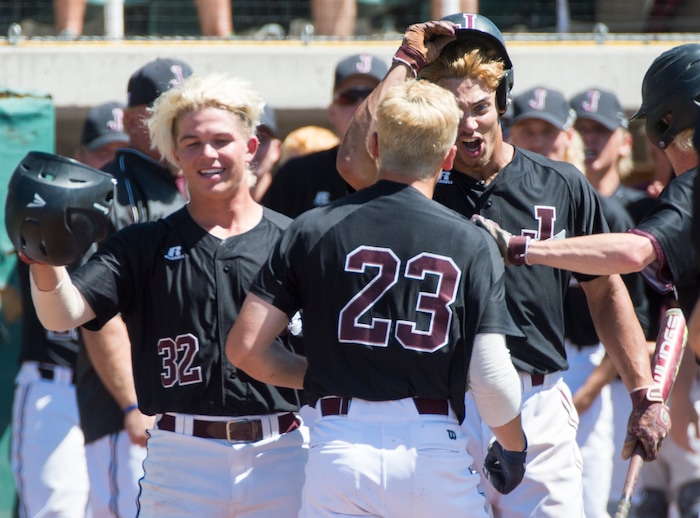 (Rick Egan  |  The Salt Lake Tribune)   Jordan High congratulates Jordan Bachman after ht hit a home run for the Beet diggers, in the 5A state baseball championship game, at UVU in Orem, Friday, May 25, 2018.