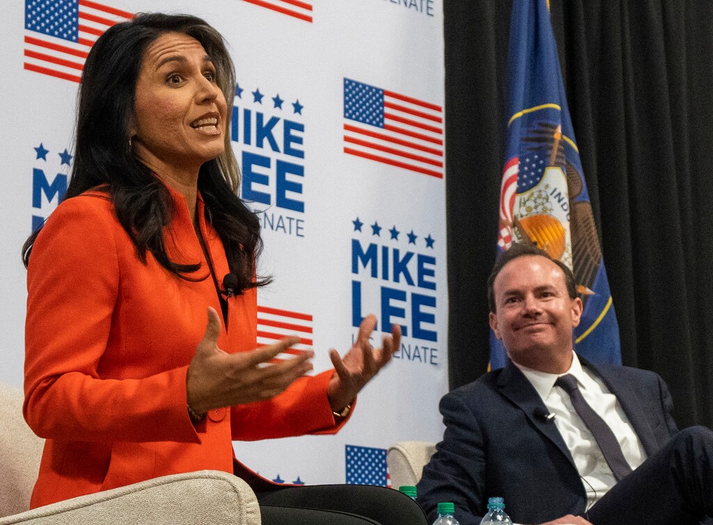 (Rick Egan | The Salt Lake Tribune)  Tulsi Gabbard speaks on stage with Sen. Mike Lee during a rally in Draper, Utah on Thursday, Oct. 27, 2022.