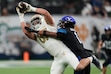 (John Locher | AP) Notre Dame tight end Michael Mayer (87) makes a catch over BYU defensive back Micah Harper (1) when the two schools played each other in Las Vegas in 2022.