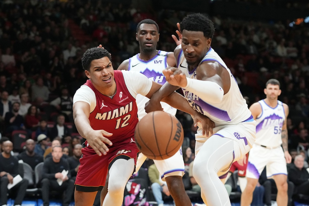 (Marta Lavandier | AP) Miami Heat guard Dru Smith (12) and Utah Jazz forward Jaren Jackson Jr. (20) go after a loose ball during the first half of an NBA basketball game Monday, Feb. 9, 2026, in Miami.