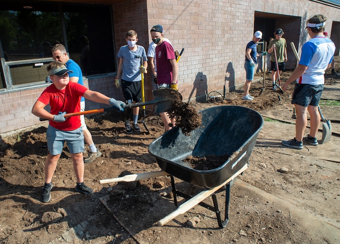 (Rick Egan  |  The Salt Lake Tribune) Members of  the LDS Highland Utah South Stake, help xeriscape the grounds of Congregation Koa Ami, on Wednesday, Aug. 5, 2020.