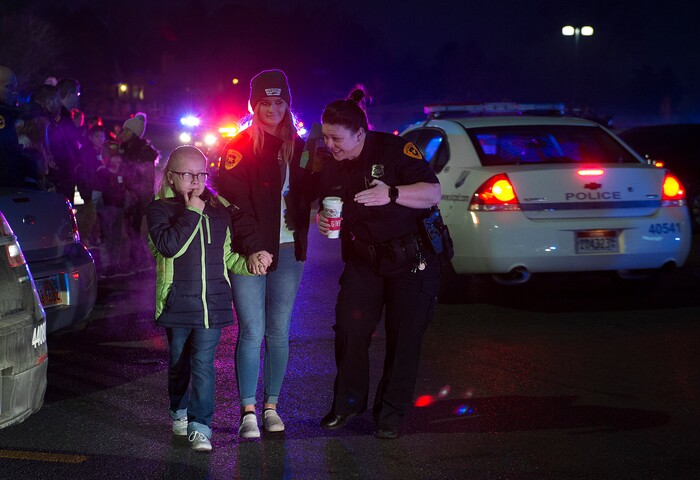 (Scott Sommerdorf   |  The Salt Lake Tribune)   Officers and children arrive at the first ever Police Pay It Forward event at the Walmart store on Parley's Way, Saturday, December 16, 2017.  