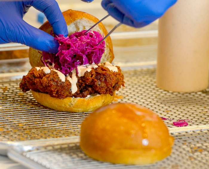 (Steve Griffin  |  The Salt Lake Tribune)  The chicken sandwich at Pretty Bird, a new Nashville-style hot chicken restaurant on Regent Street, in Salt Lake City Monday April 23, 2018.