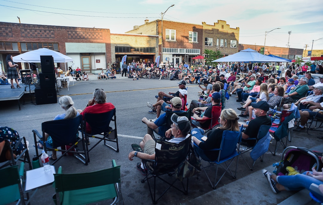 (Francisco Kjolseth  |  The Salt Lake Tribune)  People gather to listen to contestants perform in Helper Idol, a musical contest paired up alongside the monthly gallery stroll called Helper First Fridays. Helper has been discovered by a variety of artists and dreamers seeking to escape the hustle of the Wasatch Front and lured by cheap real estate prices. Helper today resembles Park City in the late 1960s. Some aging, empty buildings remain, but newcomers joining natives are slowly reinventing the little town of just over 2,000 residents as an artist colony and tourist destination.