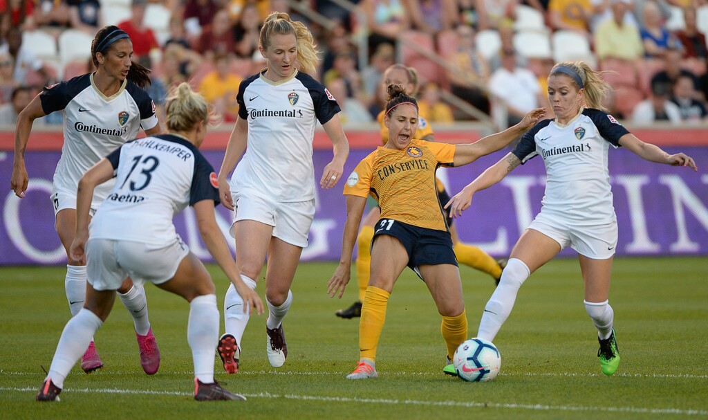 (Francisco Kjolseth  |  The Salt Lake Tribune)  Utah Royals FC midfielder Veronica Boquete (21) gets caught up in the competition as Utah Royals FC hosts the North Carolina Courage at Rio Tinto Stadium in Sandy, Utah on Saturday, July 27, 2019.
