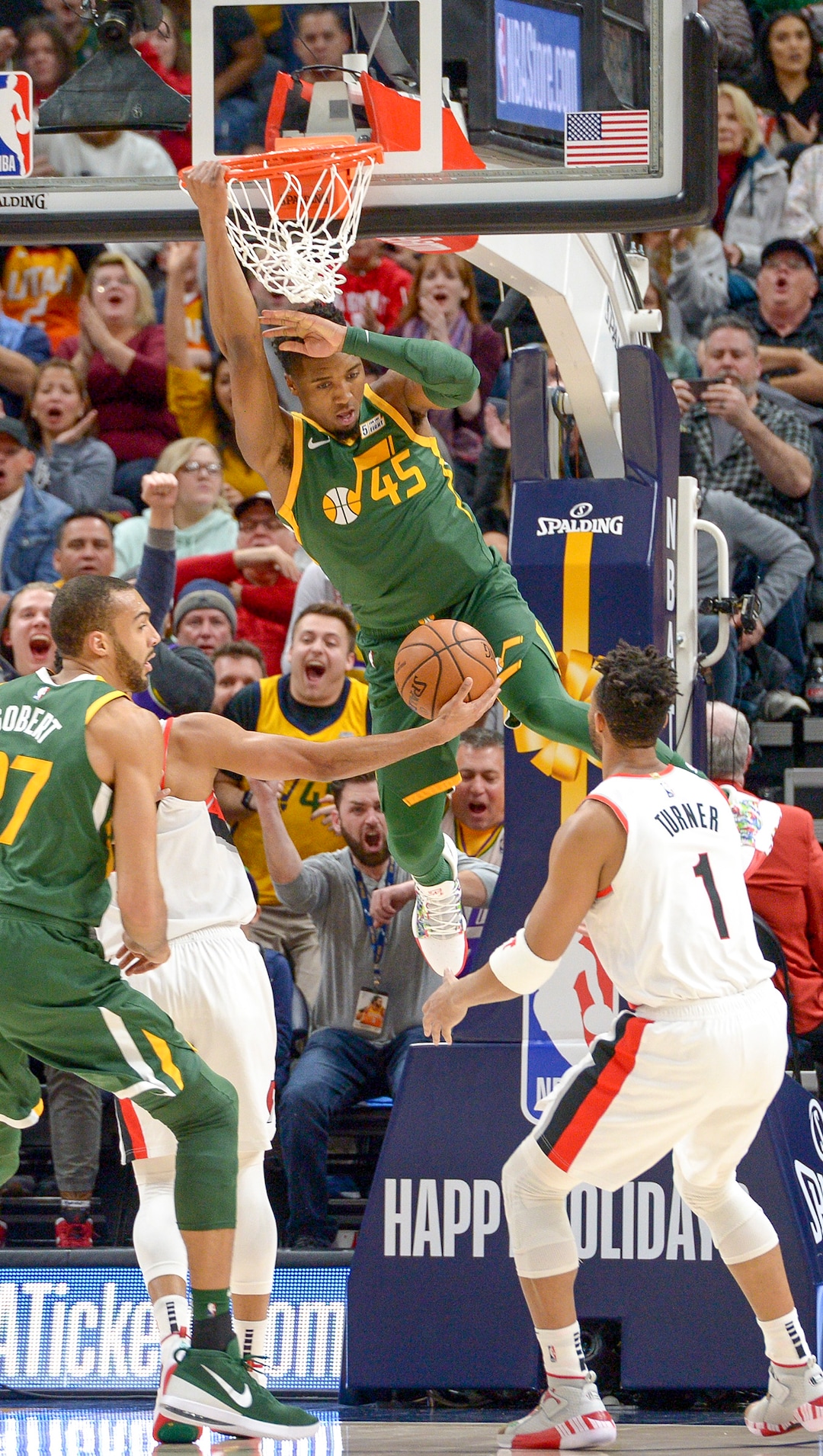 Leah Hogsten  |  The Salt Lake Tribune Utah Jazz guard Donovan Mitchell (45) dunks on the Trail Blazers as the Utah Jazz host the Portland Trail Blazers Christmas night at Vivint Smart Home Arena.