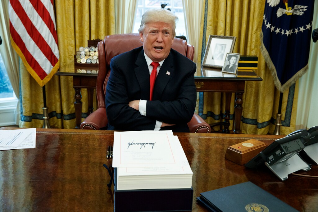 (Evan Vucci | AP file photo)
In this Dec. 22, 2017, photo, President Donald Trump speaks with reporters after signing a tax bill and resolution in the Oval Office of the White House in Washington.