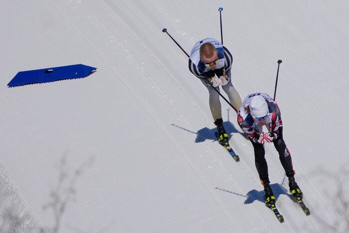 (Francisco Kjolseth | The Salt Lake Tribune) Bjorn Riksaasen, right,  of the University of Utah competes in the men’s 10K classic during the NCAA Skiing Championships held at the Soldier Hollow Nordic Center on Thursday, March 10, 2022 in Midway, Utah. 