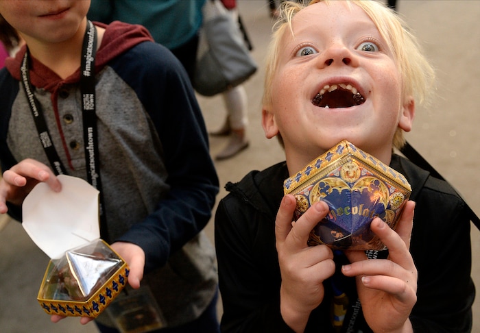 (Al Hartmann  |  The Salt Lake Tribune) 	
Young wizard Charlie Woolenzien, 7, is excited to finds a box of "chocolate frogs" at Warner Bros. Harry Potter-themed exhibit and shopping area in the Shops at South Town in Sandy. There are interactive activities in addition to "Harry Potter" and  "Fantastic Beasts and Where to Find Them" merchandise. 