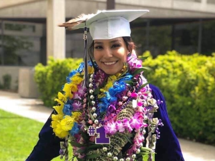 (Photo courtesy of Tasheena Savala) Pictured is Tasheena Savala with leis and decorations added after her graduation ceremony on May 29, 2019.