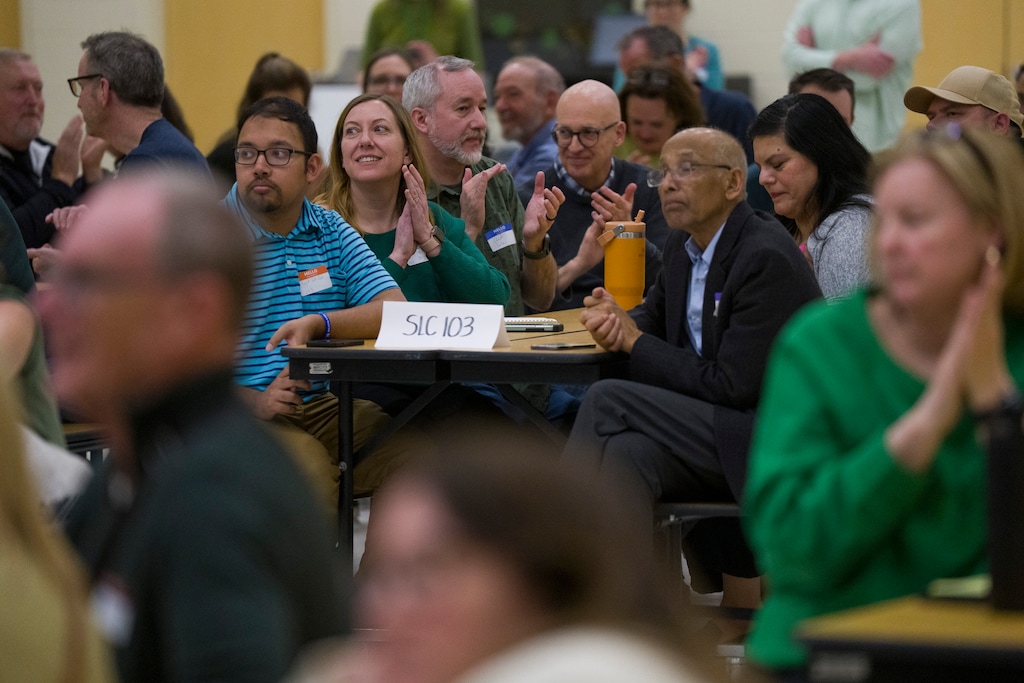 (Bethany Baker  |  The Salt Lake Tribune) People clap during caucus night for the Utah Democratic Party at Beacon Heights Elementary in Salt Lake City on Tuesday, March 17, 2026.