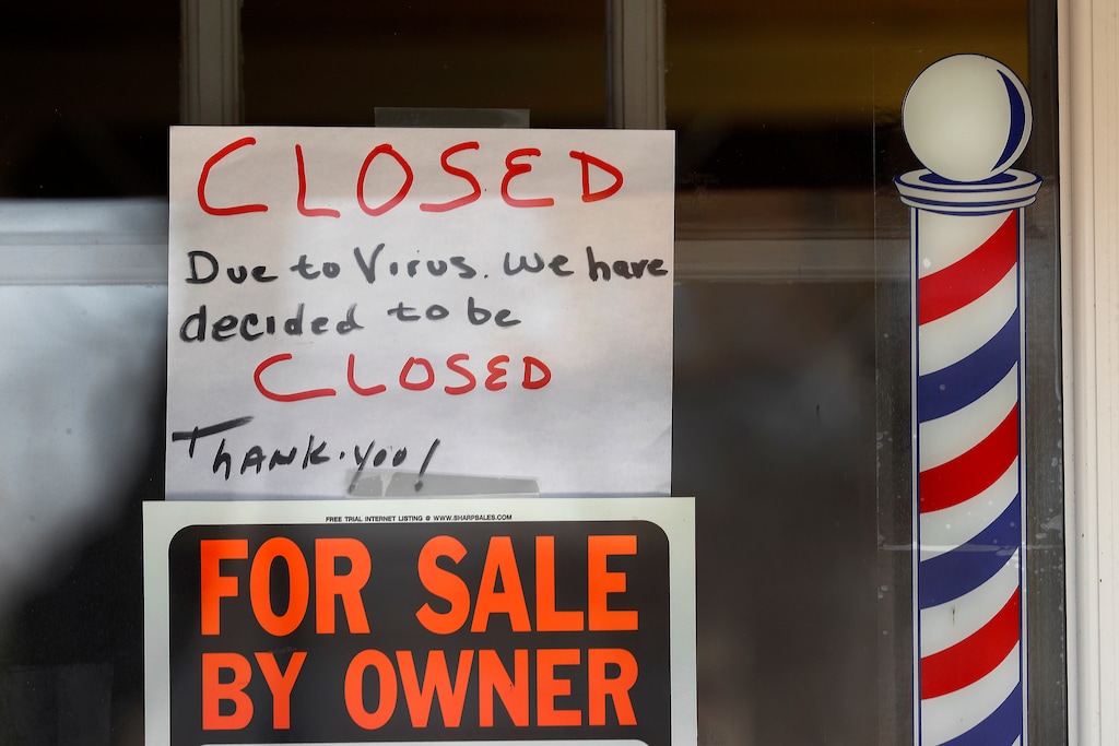 (Paul Sancya | AP) "For Sale By Owner" and "Closed Due to Virus" signs are displayed in the window of Images On Mack in Grosse Pointe Woods, Mich., Thursday, April 2, 2020. The coronavirus outbreak has triggered a stunning collapse in the U.S. workforce with 10 million people losing their jobs in the past two weeks and economists warn unemployment could reach levels not seen since the Depression, as the economic damage from the crisis piles up around the world.
