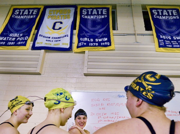 (Leah Hogsten | The Salt Lake Tribune) Members of the Pirate Swim Club, the oldest swim club in the state, share a laugh during practice on a Tuesday evening. Cyprus High School has grown and changed since the gym was constructed in 1955 followed by what may be the stateÕs oldest operating indoor pool, built in 1958. A new school is in the works, badly needed to accommodate a growing population on the west side's close-knit community, where long-time fans show up no matter how good or bad the Pirates are.