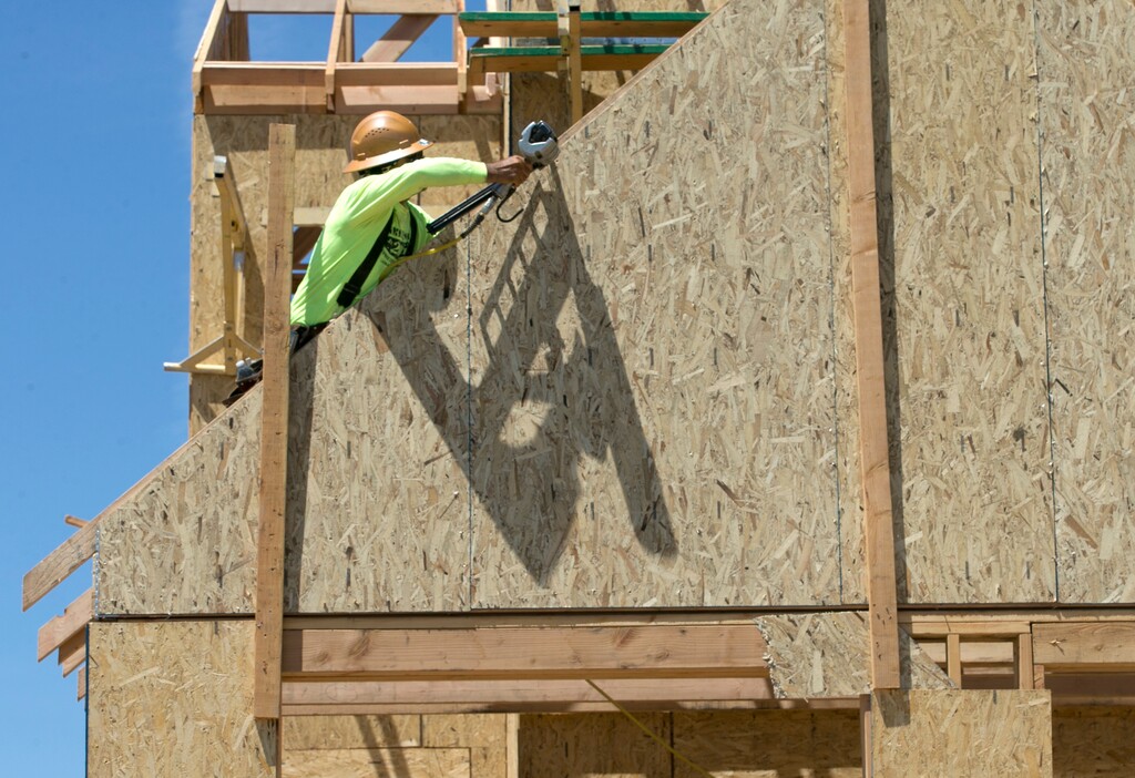 In this Friday, June 2, 2017 photo work is done on a home under construction in Sacramento, Calif. California Lawmakers took steps to fix the state's affordable housing shortage by passing bills to speed construction and generate money for subsidized housing. (AP Photo/Rich Pedroncelli)