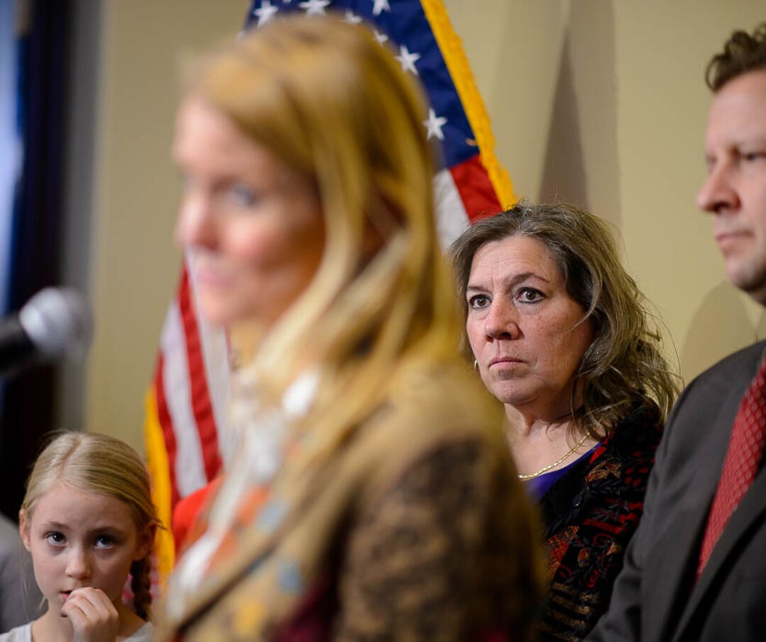 (Trent Nelson | The Salt Lake Tribune)  Valley View Elementary School teacher Moana Patterson listens as Tiffany Ivens-Spence speaks at a news conference by parents and students to show support for Patterson, in Salt Lake City on Monday March 11, 2019. Sen. Todd Weiler, R-Woods Cross, at right. Ivens-Spence is the parent of a student at the school.