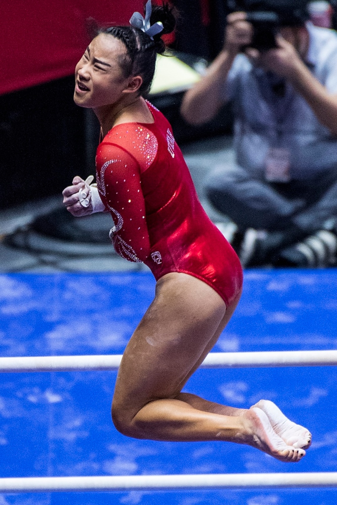 (Chris Detrick  |  The Salt Lake Tribune)  Utah's Kim Tessen competes on the bars during the gymnastics meet against Brigham Young University Friday, January 5, 2018.  
