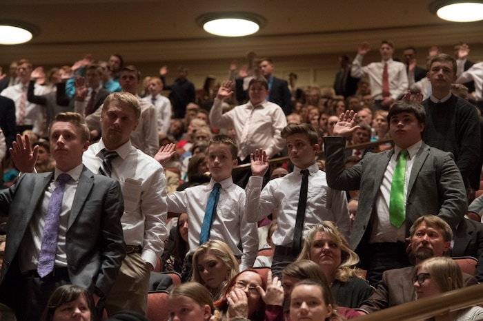 (Rick Egan  |  The Salt Lake Tribune)         LDS Aaronic priesthood members, stand to sustain President Russell M. Nelson and the first presidency of the church, during a  Solemn Assembly in the Saturday morning session of the 188th Annual General Conference in Salt Lake City,  Saturday, March 31, 2018.