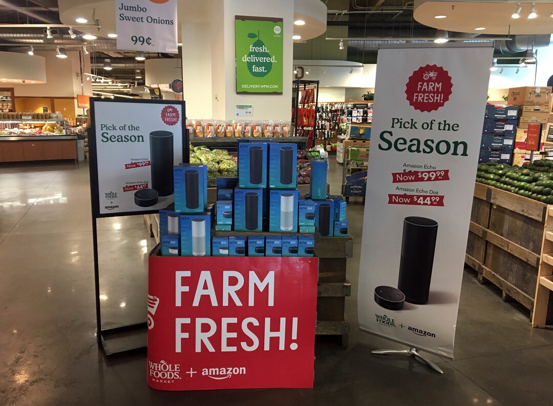 Amazon's Echo and Echo Dot appear on sale at a Whole Foods Market in New York, Monday, Aug. 28, 2017. Amazon has completed its $13.7 billion takeover of organic grocer Whole Foods, and the e-commerce giant is wasting no time putting its stamp on the company. Prices were lowered; Whole Foods brands will soon be on Amazon's site; and Amazon's Prime members could soon get discounts at Whole Foods. The deal could also spur changes in the wider grocery industry. (AP Photo/Joseph Pisani)