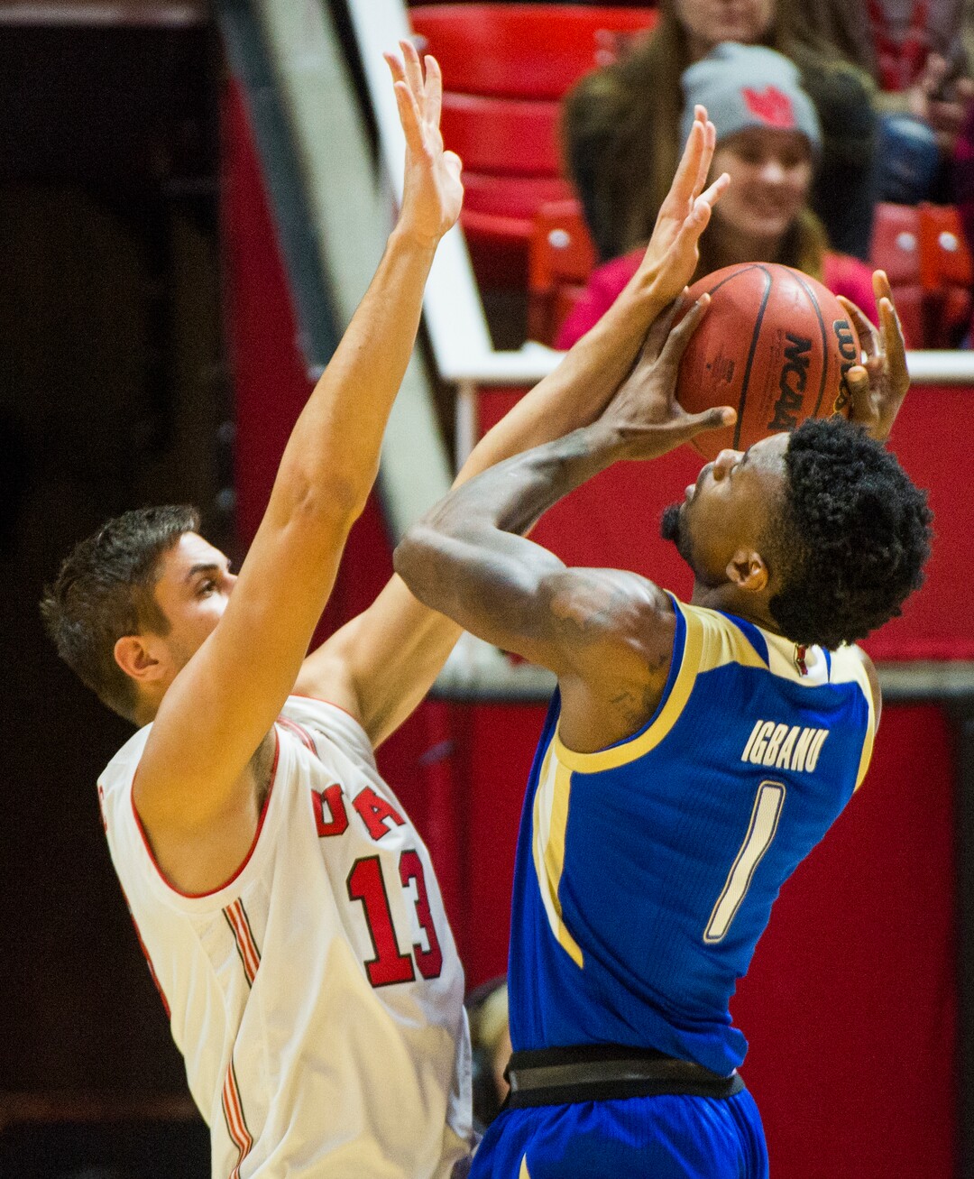 (Rick Egan  |  The Salt Lake Tribune)        Tulsa Golden Hurricane forward Martins Igbanu (1) shoots as Utah Utes forward Novak Topalovic (13) defends, , in basketball action between, Utah Utes and Tulsa Golden Hurricane, at the Jon M. Huntsman Center, Saturday, Dec. 1, 2018.