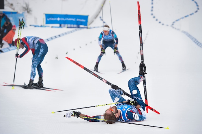 (Scott Sommerdorf   |  The Salt Lake Tribune)   
Racers collapse after crossing the finish line in the 10K cross country race. Bryan Fletcher won the Nordic Combined Olympic Trials in Park City, Saturday, December 30, 2017.