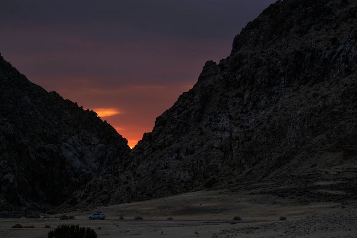 (Leah Hogsten | The Salt Lake Tribune) The sun is shown setting within the vee of the Parowan Gap, a day prior to the spring equinox observance, Saturday, Mar. 19, 2021.