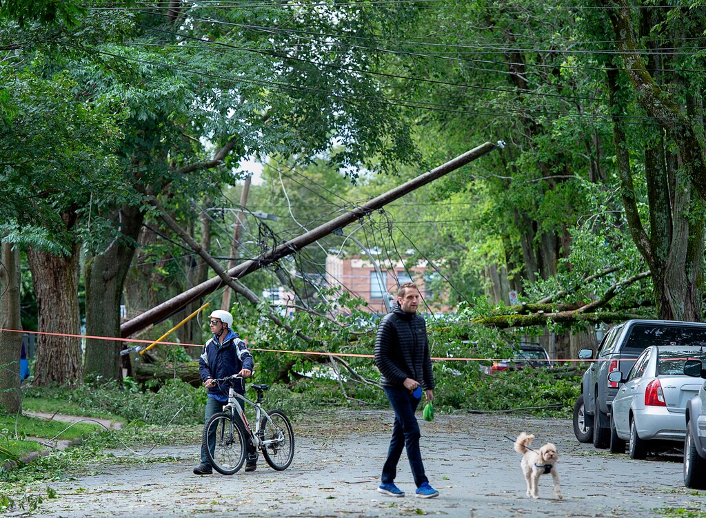 (Andrew Vaughan | The Canadian Press via AP) A street is blocked by fallen trees as a result of Hurricane Dorian pounding the area with heavy rain and wind in Halifax, Nova Scotia, on Sunday, Sept. 8, 2019. Hurricane Dorian brought wind, rain and heavy seas that knocked out power across the region, left damage to buildings and trees as well as disruption to transportation.