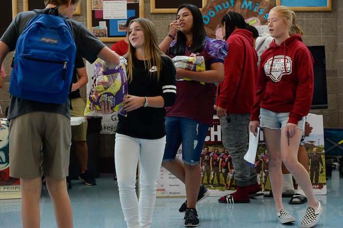 (Francisco Kjolseth | The Salt Lake Tribune) Sam Gordon, 14, works her fellow students at Herriman High School in an effort to drum up support for girls to play football during a recent clubs sign up day. Brent Gordon and his daughter, Sam, are part of a group suing multiple school districts to try to force the creation of sanctioned girls high school football that would play in the Spring.