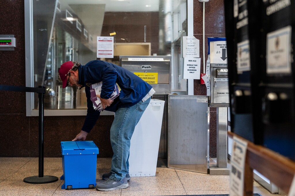 (Eric Lee | The New York Times) An official picks up mailed ballots in Scranton, Pa., Nov. 5, 2024. President Trump has claimed mail voting was a source of fraud during the 2020 presidential election, although his former attorney general said his assertions of widespread fraud couldn’t be proven.