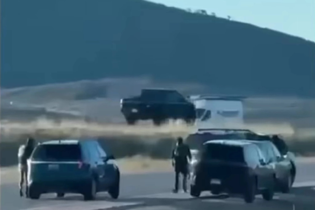 (Brenda Ramirez) A bystander's video shows what appear to be federal agents around a car parked on the eastbound on-ramp at U.S. Highway 40 exit 4 early April 29, 2026.