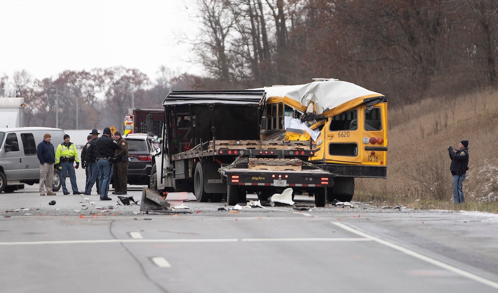 (Santiago Flores | AP file photo via South Bend Tribune) In this Dec. 5, 2018, file photo, Indiana State Police investigate a collision between an East Pulaski school bus and truck in Argos, Ind.